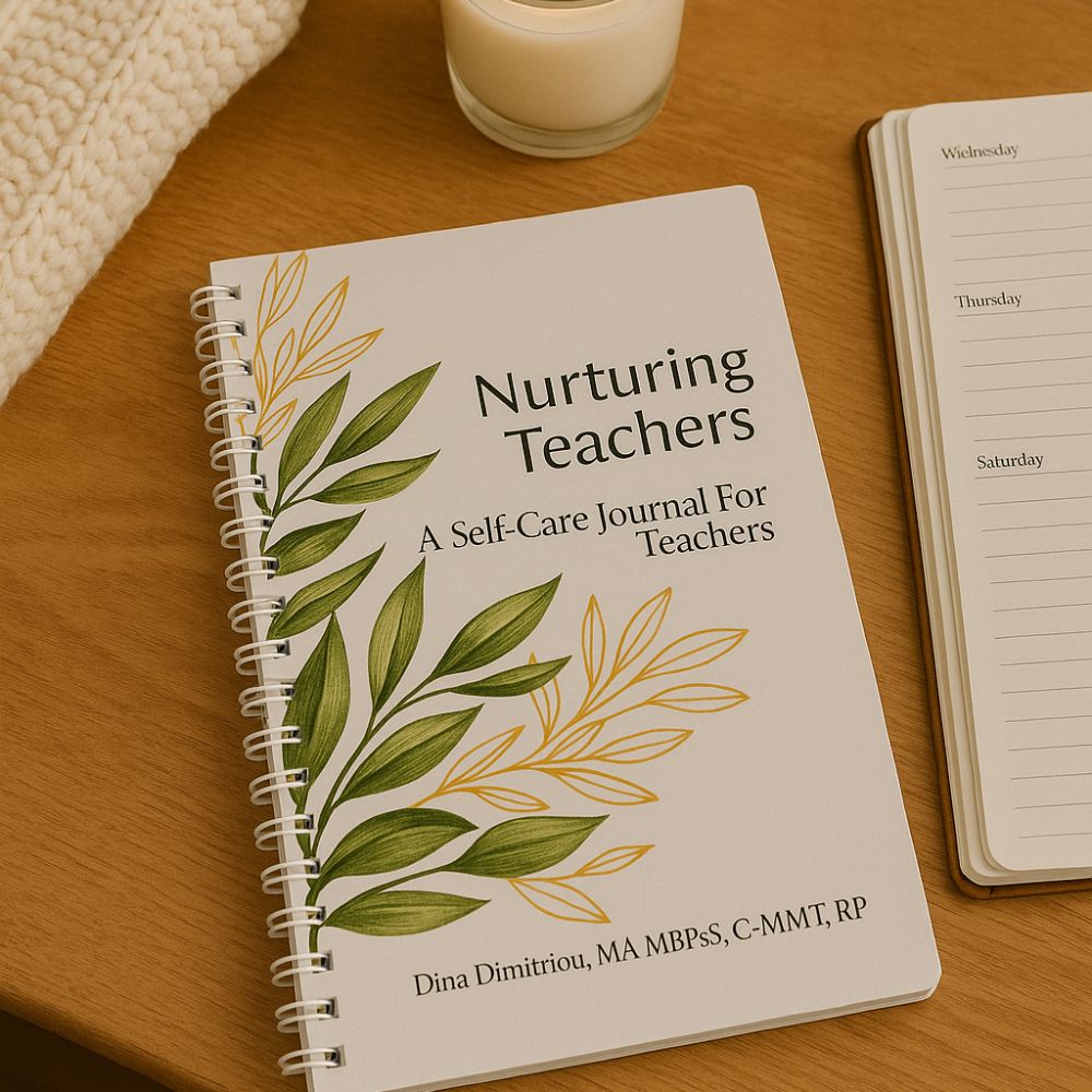 "Nurturing Teachers self-care journal on a wooden desk with a planner, candle, and cozy knit – a mental health and wellness journal designed for teachers."